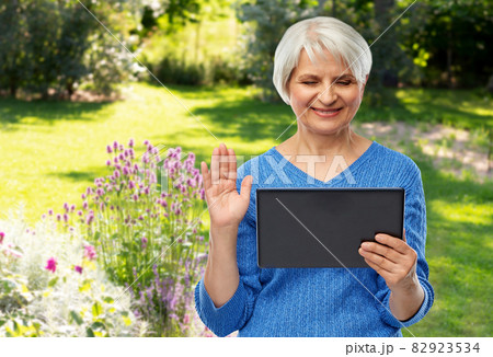 senior woman having video call on tablet computer senior woman having video call on tablet computer 82923534