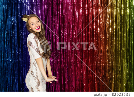 happy young woman or girl in party dress and crown happy young woman or girl in party dress and crown 82923535