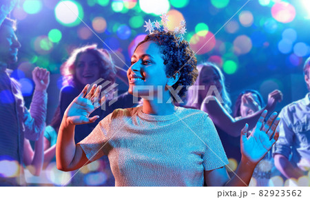 african woman dancing at party at nightclub 82923562