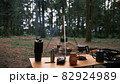 Coffee drip while camping in the forest. Coffee maker outdoor, campsite morning picnic lifestyle, person cooking hot drink in nature camping, cooker prepare breakfast. Sunrise and chill time in camp 82924989