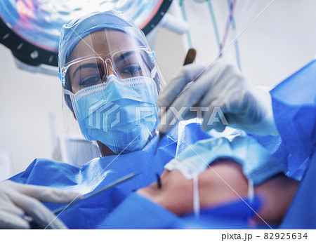 Doctor and patient during surgery Doctor and patient during surgery 82925634