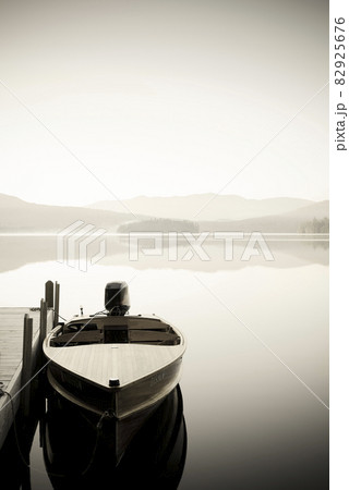 Usa, New York, North Elba, Wooden boat docked on Lake Placid 82925676