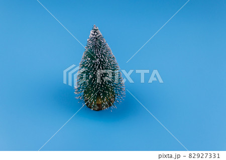 Christmas tree on a pastel blue background. Christmas or New Year concept. Minimal design 82927331