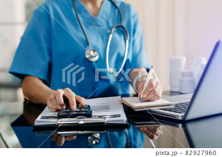 Medical technology concept. Doctor working with mobile phone and stethoscope and digital tablet laptop in modern office at hospital Medical technology concept. Doctor working with mobile phone and stethoscope and digital tablet laptop in modern office at hospital 82927960