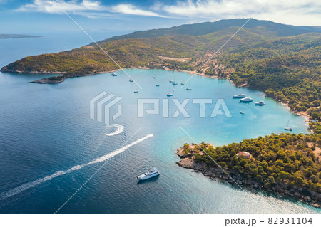 Yacht sailing near the rocky coast in Turkey. Luxury vacation at sea Yacht sailing near the rocky coast in Turkey. Luxury vacation at sea 82931104