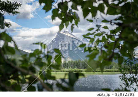 Majestic mountain Mount Rundle framed by tree branches ,Banff National Park, Canada 82932298