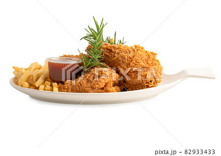 Fried chicken and potato chip with rosemary leaf, Junk food high calorie served on white plate isolated on white background with clipping path 82933433