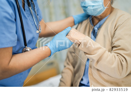 Asian senior or elderly old lady woman patient wearing a face mask new normal in hospital for protect safety infection Covid-19 Coronavirus. Asian senior or elderly old lady woman patient wearing a face mask new normal in hospital for protect safety infection Covid-19 Coronavirus. 82933519