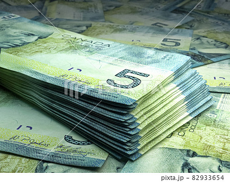 Canadian money. Canadian dollar banknotes. 5 CAD dollars bills. Canadian money. Canadian dollar banknotes. 5 CAD dollars bills. 82933654