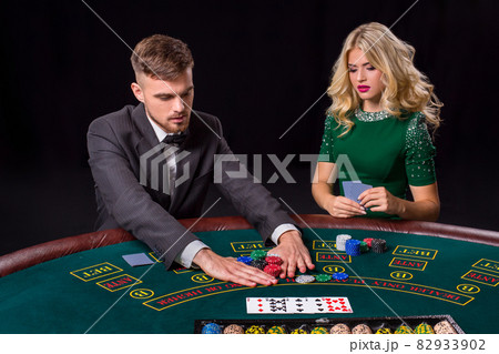 couple playing poker at the table. couple playing poker at the table. 82933902