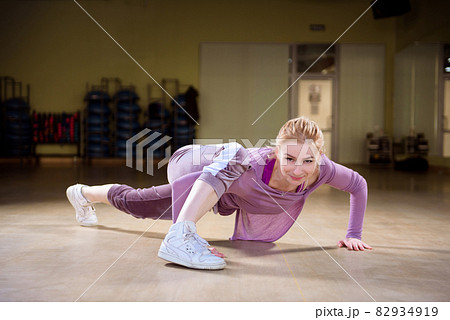 Young sports trainer dancing in the gym. 82934919