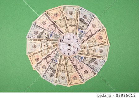 Concept of clock and dollar. Clock on mandala kaleidoscope from money. Abstract money background raster pattern repeat mandala circle. 82936615