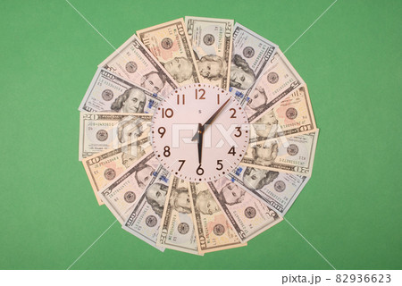 Concept of clock and dollar. Clock on mandala kaleidoscope from money. Abstract money background raster pattern repeat mandala circle. Concept of clock and dollar. Clock on mandala kaleidoscope from money. Abstract money background raster pattern repeat mandala circle. 82936623