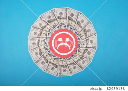 Sad smile faces on mandala kaleidoscope from money. Sad smile faces on mandala kaleidoscope from money. 82939188
