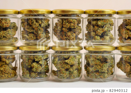 Cannabis drying and curing. Marijuana buds in glass jars 82940312