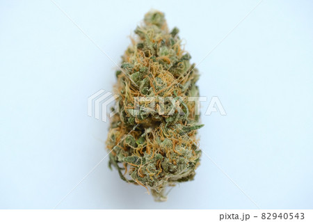 Macro view of marijuana bud close-up. Dried cannabis bloom on white background 82940543