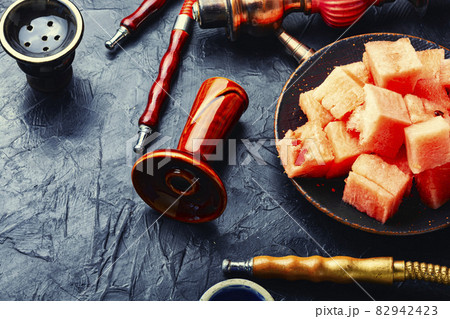 Exotic hookah for smoking with watermelon Exotic hookah for smoking with watermelon 82942423