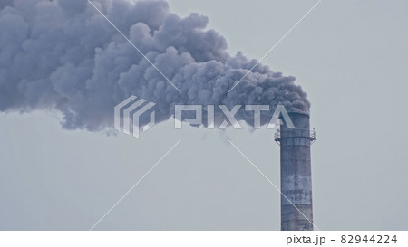 This smoke coming from the chimney in a factory. Harmful emissions into the atmosphere, from the pipe. Serious damage the environment. This smoke coming from the chimney in a factory. Harmful emissions into the atmosphere, from the pipe. Serious damage the environment. 82944224
