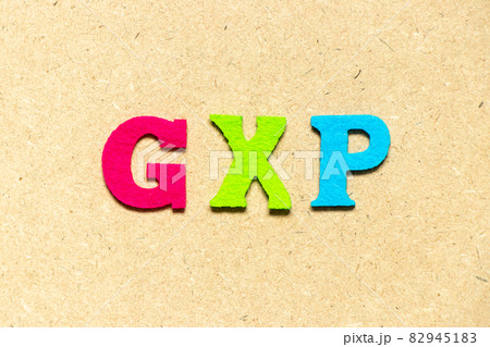 Color cloth alphabet letter in word GXP on wood background Color cloth alphabet letter in word GXP on wood background 82945183