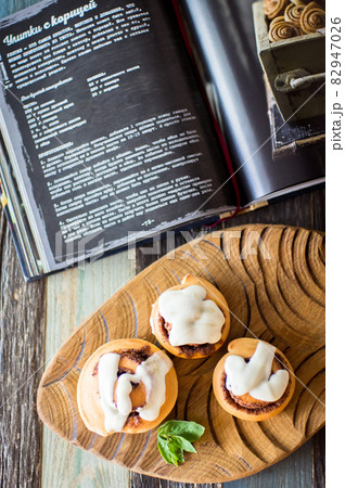 Homemade cinnamon buns and recipe book. High quality photo 82947026