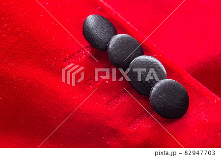 Red stylish jacket with buttons, background. Stylish clothes, macro, elegant Red stylish jacket with buttons, background. Stylish clothes, macro, elegant 82947703