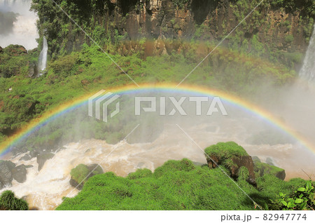 Rainbow above Iguazu falls. Rainbow above Iguazu falls. 82947774