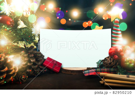Merry Christmas and a Happy New Year concept,with a decorated ornament and white paper,copy space 82950210