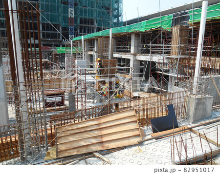 MALACCA, MALAYSIA -MAY 30, 2016: Construction site in progress at MALACCA, Malaysia during daytime. Workers busy with their task such as installing timber form work and reinforcement bar. MALACCA, MALAYSIA -MAY 30, 2016: Construction site in progress at MALACCA, Malaysia during daytime. Workers busy with their task such as installing timber form work and reinforcement bar. 82951017