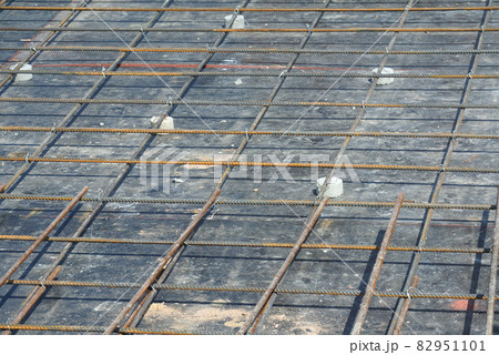 SELANGOR, MALAYSIA -MAY 13, 2016: Hot rolled deformed steel bars or steel reinforcement bar used at construction site to strengthen concrete. It is shaped follow the engineer design. SELANGOR, MALAYSIA -MAY 13, 2016: Hot rolled deformed steel bars or steel reinforcement bar used at construction site to strengthen concrete. It is shaped follow the engineer design. 82951101