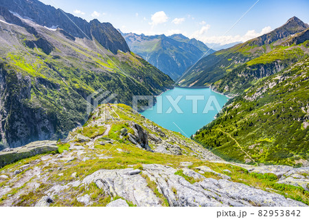 Beautiful alpine walley with azure blue water of Speicher Zillergrundl dam, Zillertal Alps, Austria 82953842