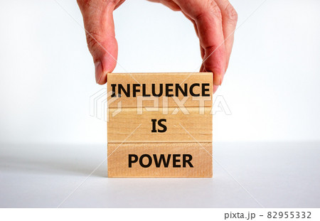Influence is power symbol. Wooden blocks with words 'Influence is power'. Beautiful white background, businessman hand. Business, influence is power concept, copy space. 82955332