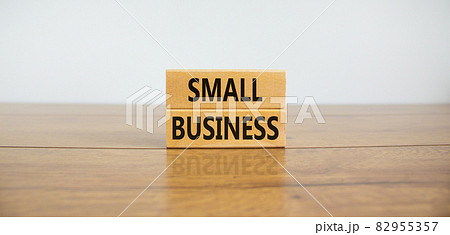 Small business symbol. Wooden blocks form the words 'small business' on beautiful wooden table, white background. Business, small business concept. Copy space. Small business symbol. Wooden blocks form the words 'small business' on beautiful wooden table, white background. Business, small business concept. Copy space. 82955357