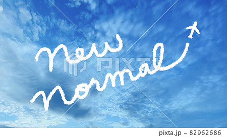 青空の上にnew Normalの文字と飛行機イラストの写真素材