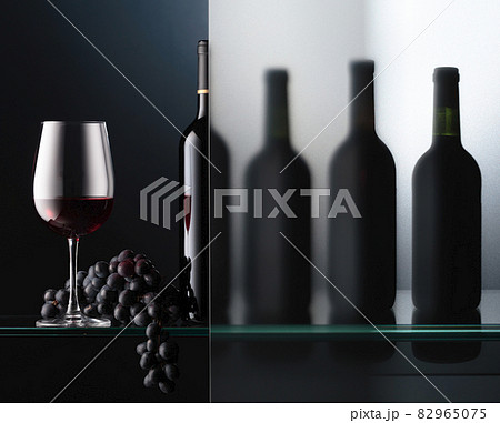 Bottles and a glass of red wine with a bunch of blue grapes. Bottles and a glass of red wine with a bunch of blue grapes. 82965075
