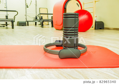 the props for fitness classes are lying on the floor 82965340