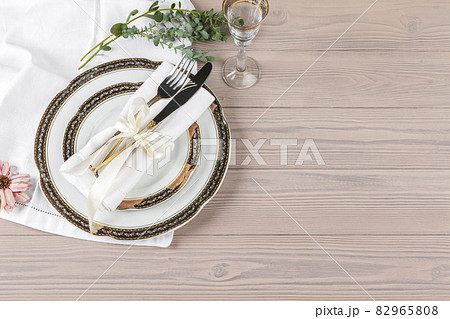 Beautiful rustic table setting on wooden table Beautiful rustic table setting on wooden table 82965808