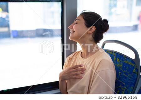 Indian Woman ride in public transport bus or tram. Indian Woman ride in public transport bus or tram. 82966168
