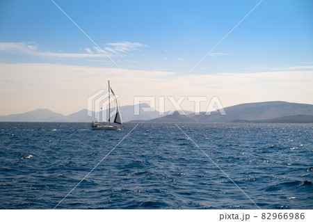 Catamaran sail Yacht cruising on deep blue sea water 82966986