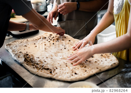 Making bread with cheese and nuts in a bakery, cheese layout 82968264