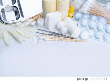 Wound care dressing set. Medical supply for diabetes, surgical and accidental wounds care. Medical equipment for nurse. Forceps, cotton stick, conform bandage, povidone-iodine bottle and latex gloves. Wound care dressing set. Medical supply for diabetes, surgical and accidental wounds care. Medical equipment for nurse. Forceps, cotton stick, conform bandage, povidone-iodine bottle and latex gloves. 82969263