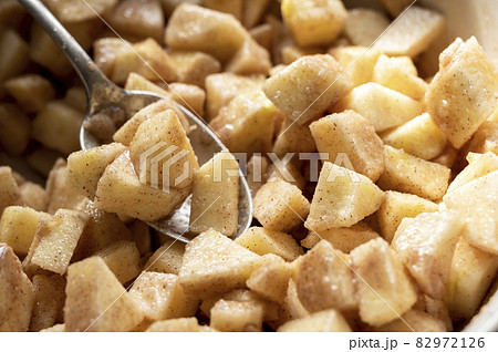 Cutted and peeled apples, close up. Cooking an apple pie or tart. Step by step recipe. 82972126