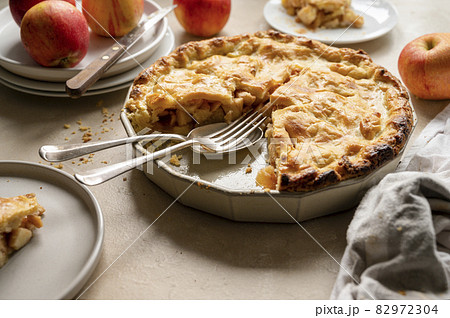Apple pie, rustic homemade fruit tart with cinnamon, top view. Apple pie, rustic homemade fruit tart with cinnamon, top view. 82972304