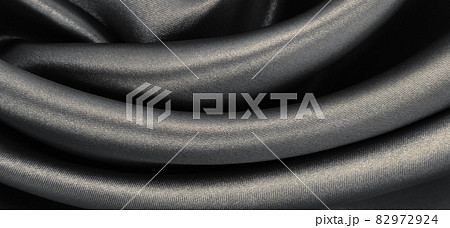 Smooth elegant brown silk or satin texture as abstract background. Luxurious background design. In Sepia toned. Retro style 82972924