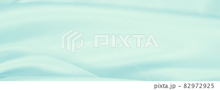 Smooth elegant blue silk or satin luxury cloth texture as abstract background. Luxurious Christmas background or New Year background design 82972925