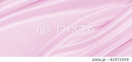 Smooth elegant pink silk or satin texture as wedding background. Luxurious background design Smooth elegant pink silk or satin texture as wedding background. Luxurious background design 82972949