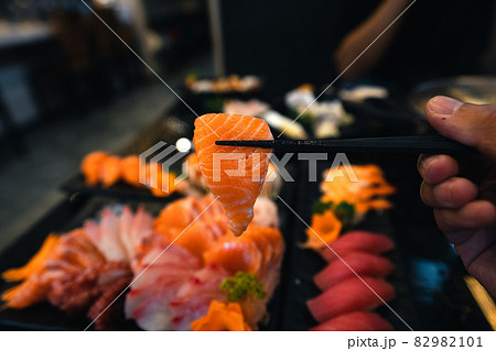 Sashimi and sashimion a plate in a Japanese restaurant Sashimi and sashimion a plate in a Japanese restaurant 82982101