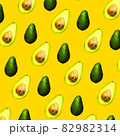 Seamless Pattern of Halves of Ripe Avocado on orange background, Healthy oily food, Keto diet 82982314
