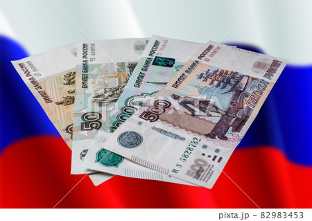 Russian rubles on a colored background. Banknotes of Russian money. Russian rubles on a colored background. Banknotes of Russian money. 82983453