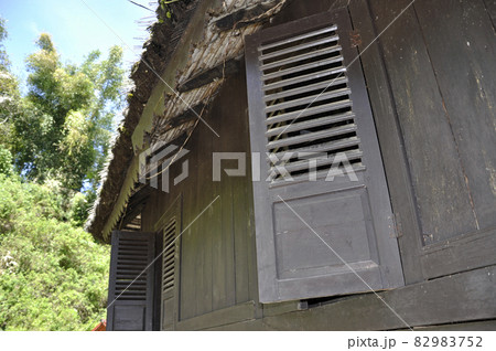 WEST SUMATERA, INDONESIA -JUNE 8, 2014: Architectural detail and wood craft at Tuo Kayu Jao Mosque in West Sumatra, Indonesia. Built in 1599 and is the second oldest mosque in Indonesia. WEST SUMATERA, INDONESIA -JUNE 8, 2014: Architectural detail and wood craft at Tuo Kayu Jao Mosque in West Sumatra, Indonesia. Built in 1599 and is the second oldest mosque in Indonesia. 82983752