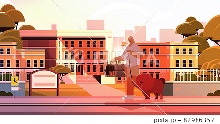 woman walking with dog and cat female owner and cute domestic animals having fun friendship with pets 82986357